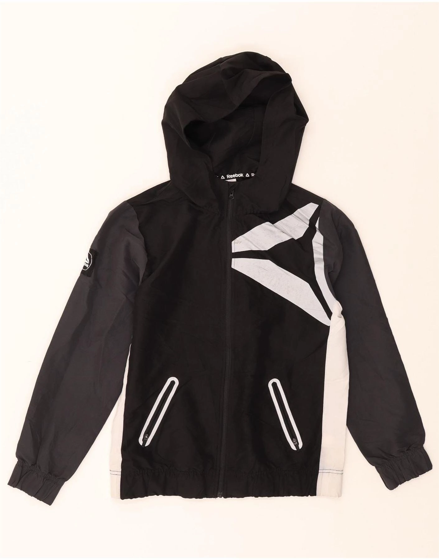 REEBOK Boys Graphic Hooded Rain Jacket 10-11 Years Large Black Colourblock Discuss Commuter Choice