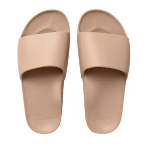 Archies Arch Support Slides in Tan Cushioned Sole running in a glass bridge area shoes
